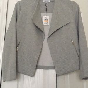 Light grey Calvin Klein jacket.